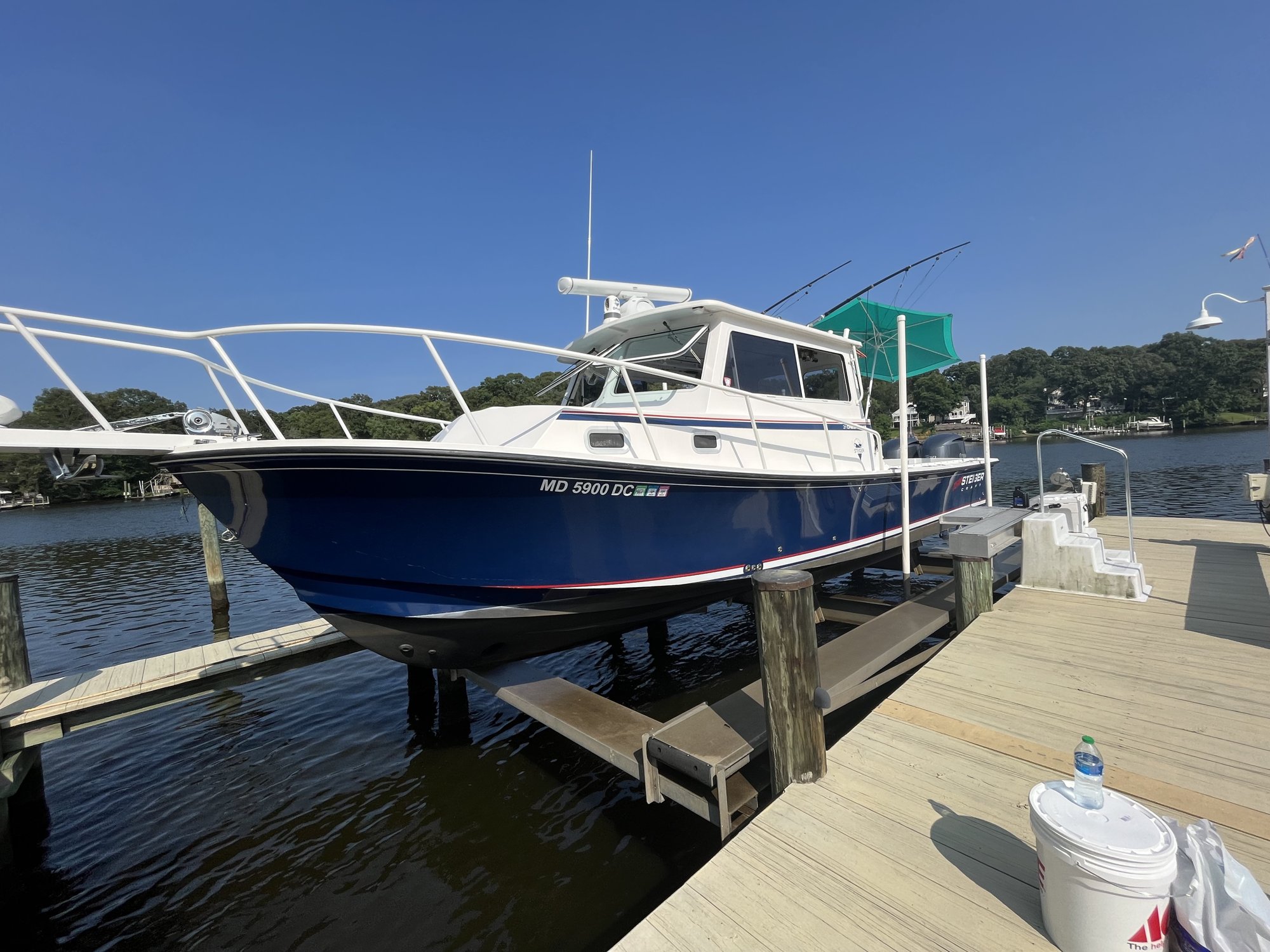 Pilothouse sportfisher raised on a boat lift