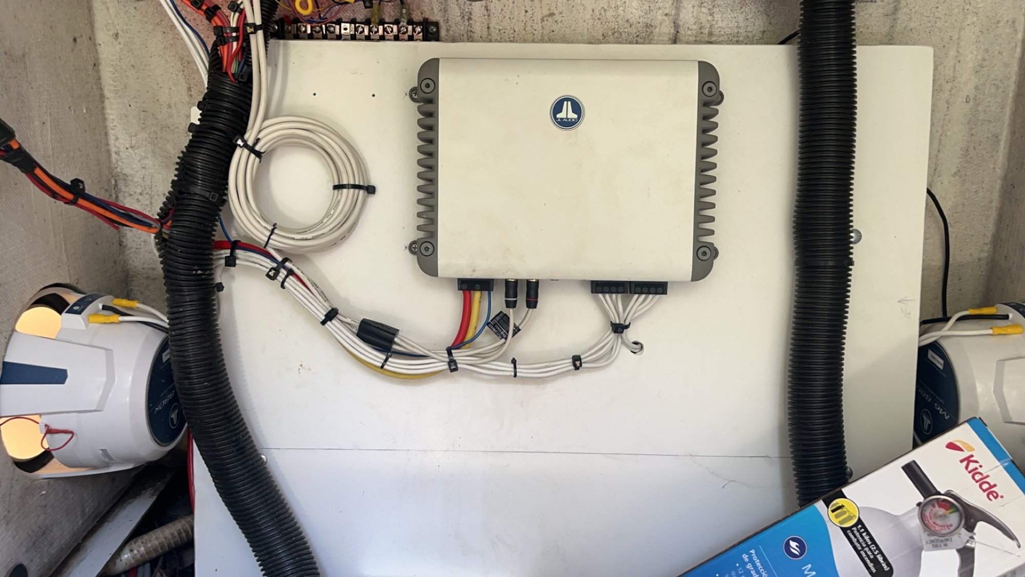 JL Audio amplifier installed with tidy, secured wiring