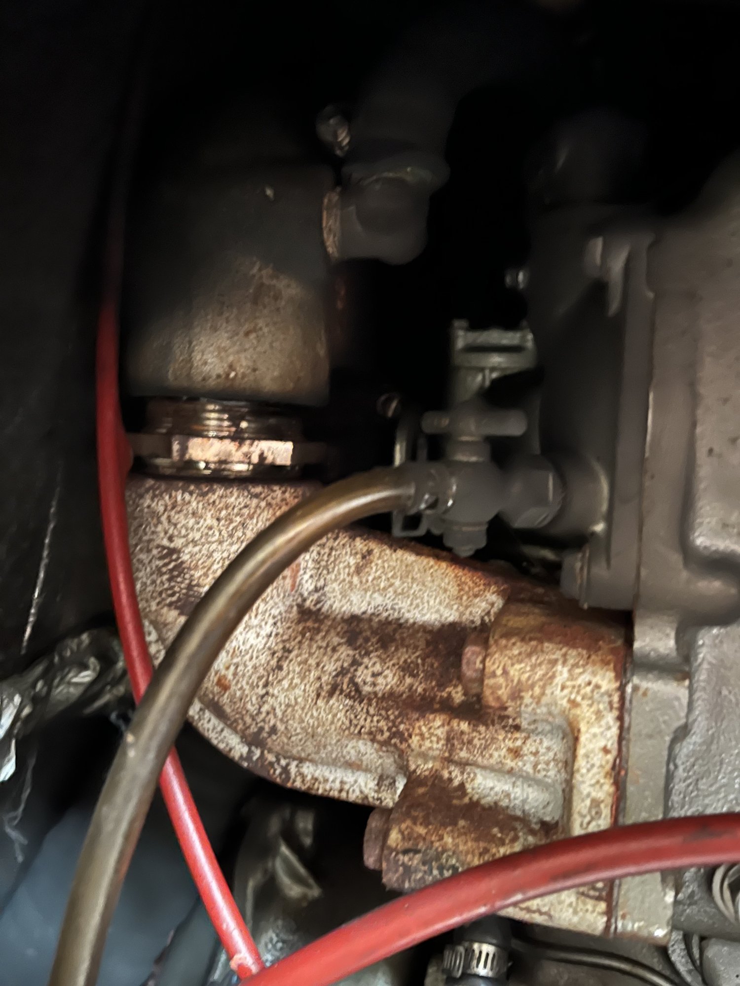 Before: heavily rusted exhaust riser on a marine engine