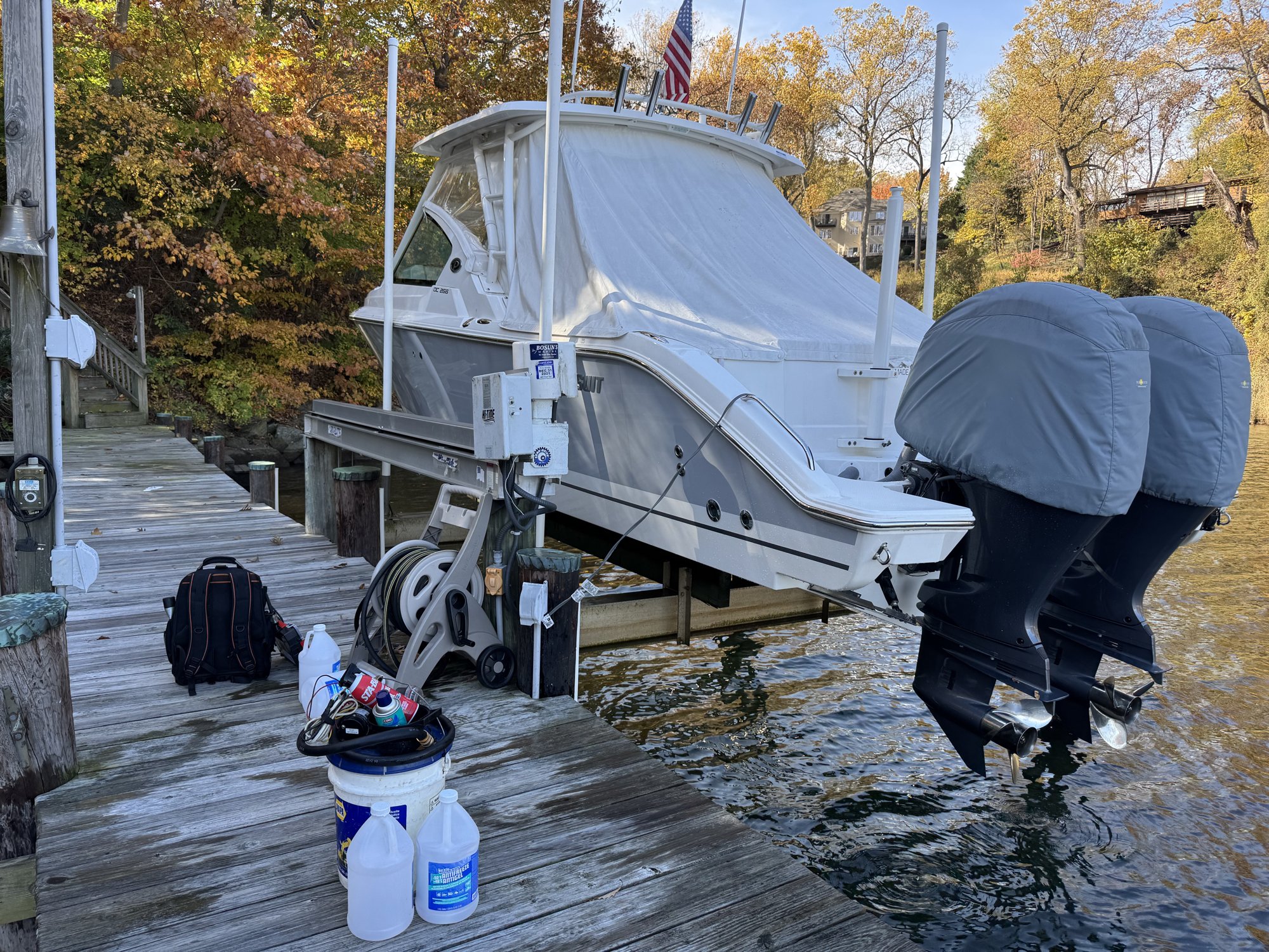 Boat on a lift with winterization in progress