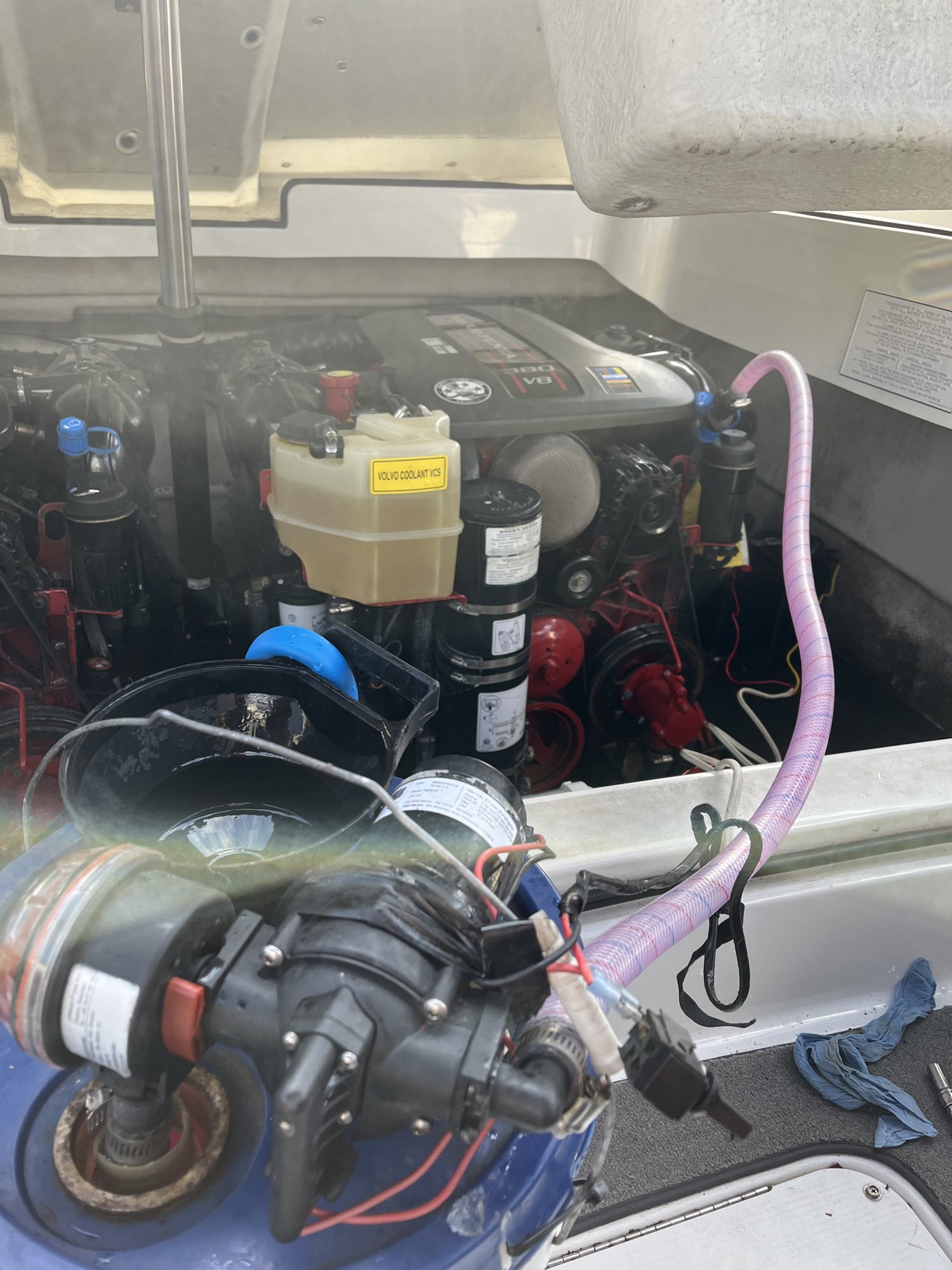 Volvo Penta V8 being winterized with the antifreeze rig hooked up